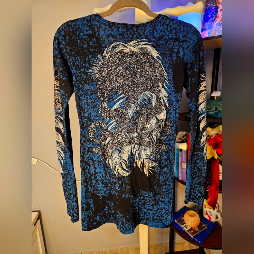 Affliction long-sleeved size small. Blue with metallic skull and crossbones.